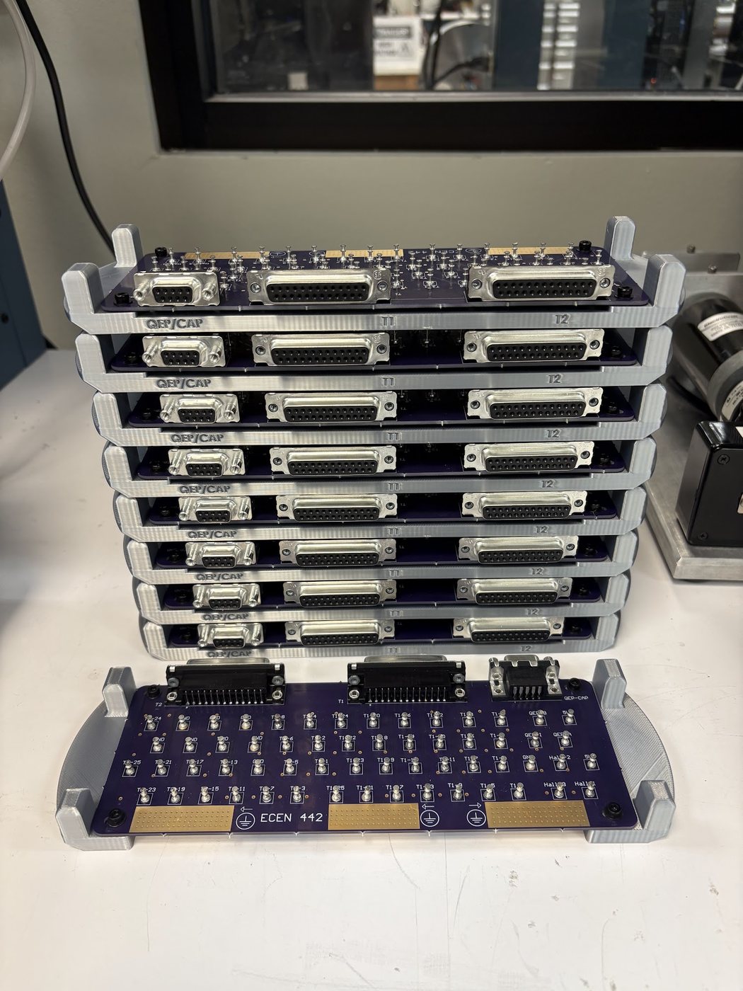 The finished run of boards stacked in their holders, ready for the lab benches.